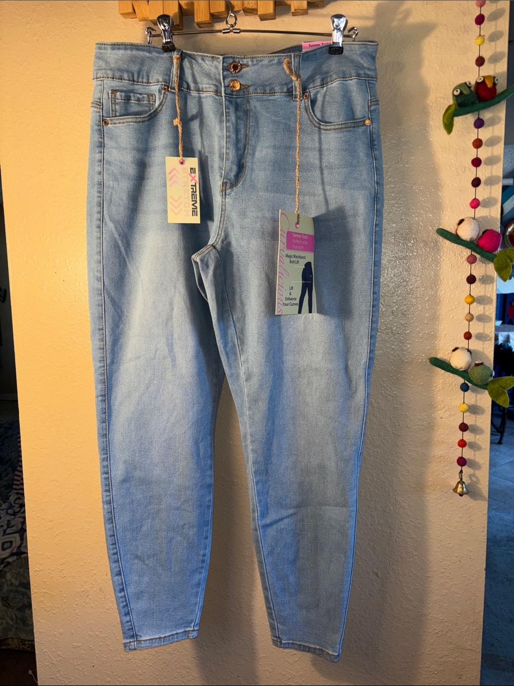 NWT Curvalicious brand light wash jeans feature a "tummy tuck" magic waistb